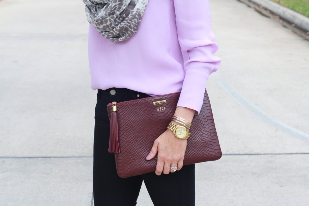 Purple shirt with black jeans and merlot accessories