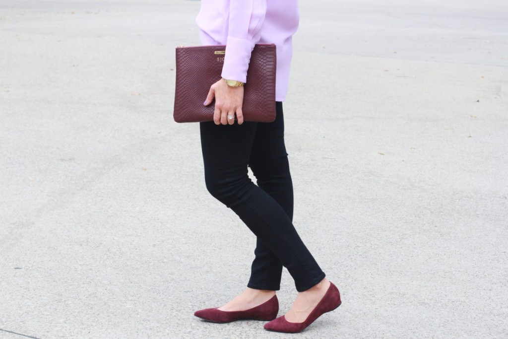 Purple shirt with black jeans and merlot accessories