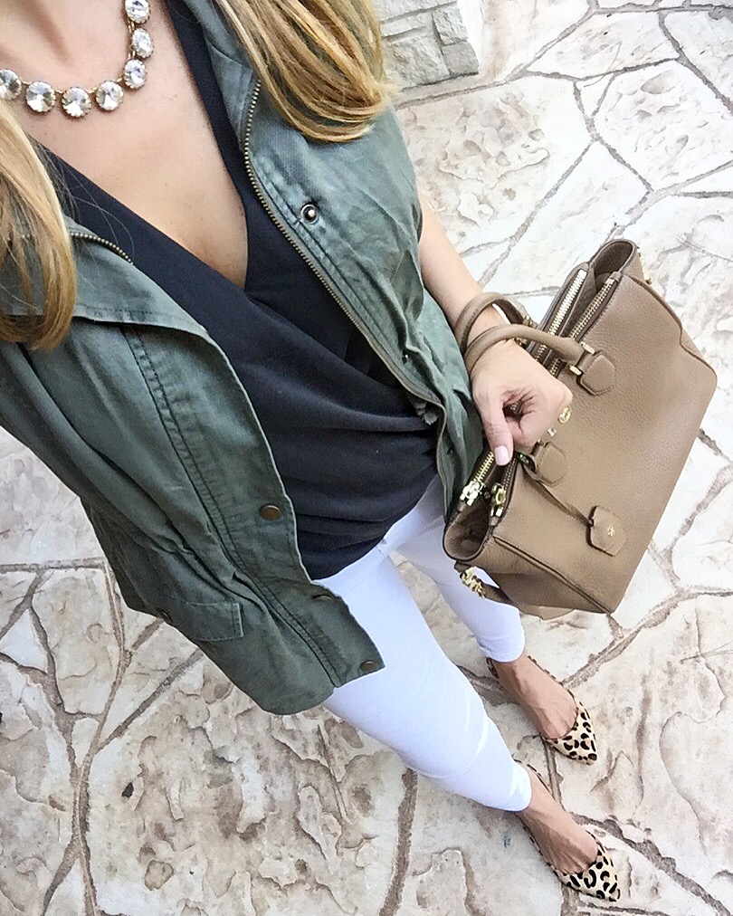 white jeans and military vest