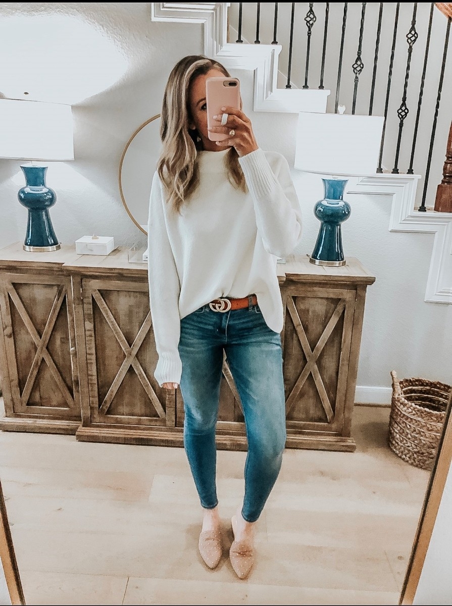 Amazon Favorites featured by top US fashion blog Haute & Humid; Image of a woman wearing Amazon sweater, dupe Gucci belt, Steve Madden sliders and American Eagle jeans.