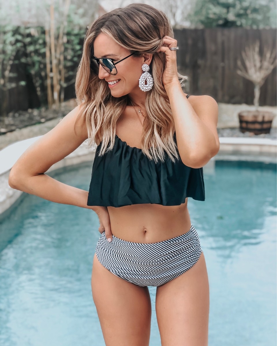 high waisted swimsuit | 8 Affordable Swimsuits For Summer featured by top US life and style blog, Haute & Humid; image of a woman wearing an Amazon swimsuit, red dress sunglasses, Amazon eearings, and shopbop necklace. 