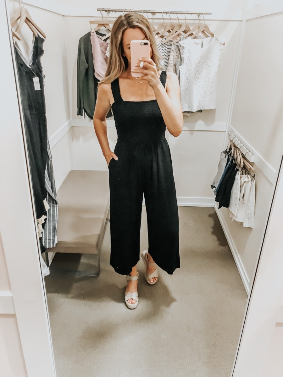 Spring Favorites featured by top US fashion blog Haute & Humid; Image of a woman wearing LOFT black jumpsuit.