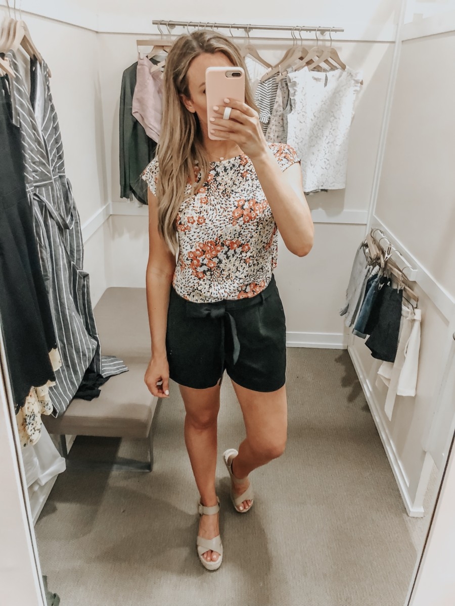 loft shorts | LOFT Favorites: Spring Dressing Room Try-On Session featured by top US fashion blog, Haute & Humid; image of woman wearing a LOFT black high wasted tie shorts and floral top