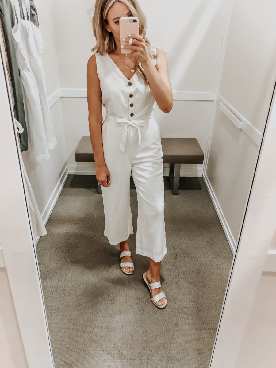 Best Memorial Day Weekend Sales featured by top US fashion blog Haute & Humid; Image of a woman wearing LOFT white jumpsuit.