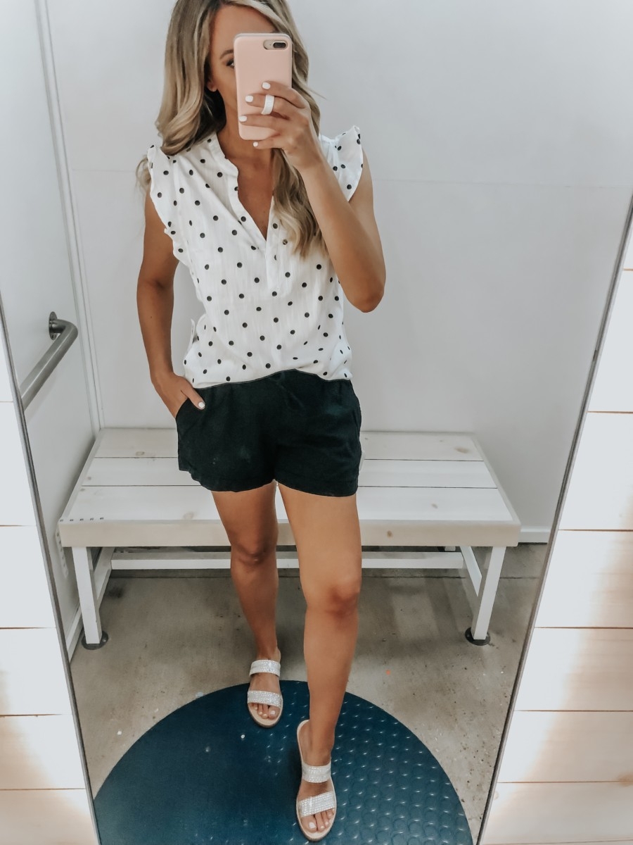 Best Memorial Day Weekend Sales featured by top US fashion blog Haute & Humid; Image of a woman wearing Old Navy polkadot top and Old Navy shorts.