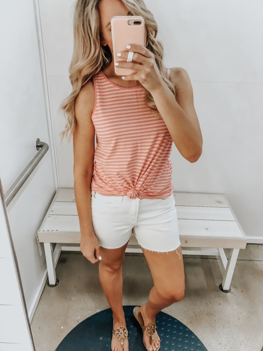 Best Memorial Day Weekend Sales featured by top US fashion blog Haute & Humid; Image of a woman wearing Old Navy striped tank top and Old Navy white denim shorts.