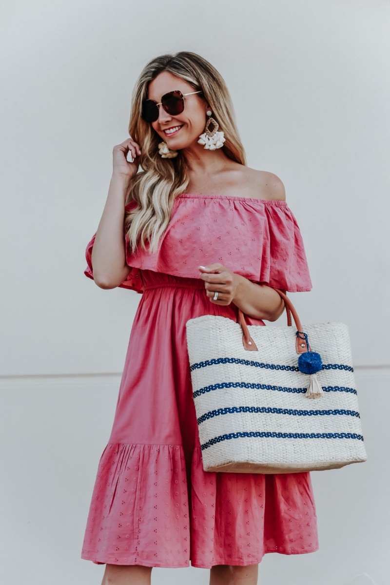 walmart dress | 3 Cute Summer dresses by popular Houston fashion blog Haute and Humid: image of woman wearing a pink off shoulder and eyelet Sofia Jeans by Sofia Vergara, brown Circus by Sam Edelman espadrilles, sunglasses, cream hoop tassel earrings, and holding an Eliza May Rose Small Toile Basket Tote from Walmart. 