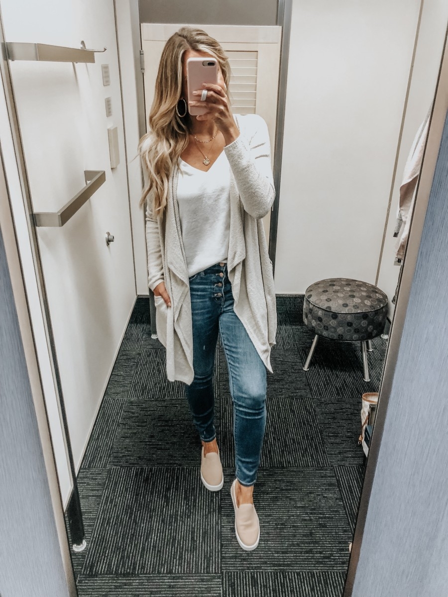 barefoot dreams cardigan | Nordstrom Anniversary Sale Favorites by popular Houston fashion blog, Haute and Humid: image of woman in a dressing room wearing Barefoot Dreams Drape Cardigan, white V-Neck Tee by BP., 10-Inch High Waist Skinny Jeans: Button Front Edition by MADEWELL, and GrandPro Spectator 2.0 Slip-On by COLE HAAN