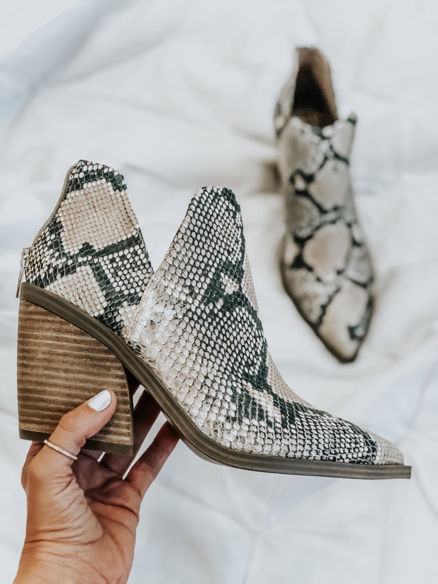 snake print bootie | Nordstrom Anniversary Sale Favorites by popular Houston fashion blog, Haute and Humid: image of woman holding a Gigietta Bootie by VINCE CAMUTO
