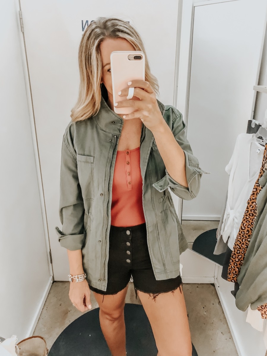old navy try on | Old Navy Try On - August 2019 by popular Florida fashion blog, Haute and Humid: image of a woman standing in a Old Navy dressing room and wearing a Old Navy Tank, Canvas Utility Jacket and Old Navy High-Waisted Button-Fly Jean Cut-Offs.