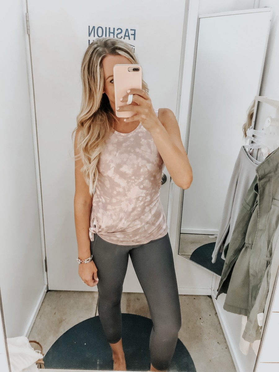 workout top | Old Navy Try On - August 2019 by popular Florida fashion blog, Haute and Humid: image of a woman standing in a Old Navy dressing room and wearing Old Navy High-Waisted Elevate Built-In Sculpt 7/8-Length Compression Leggings and Old Navy Breathe ON V-Back Side-Vent Tank.