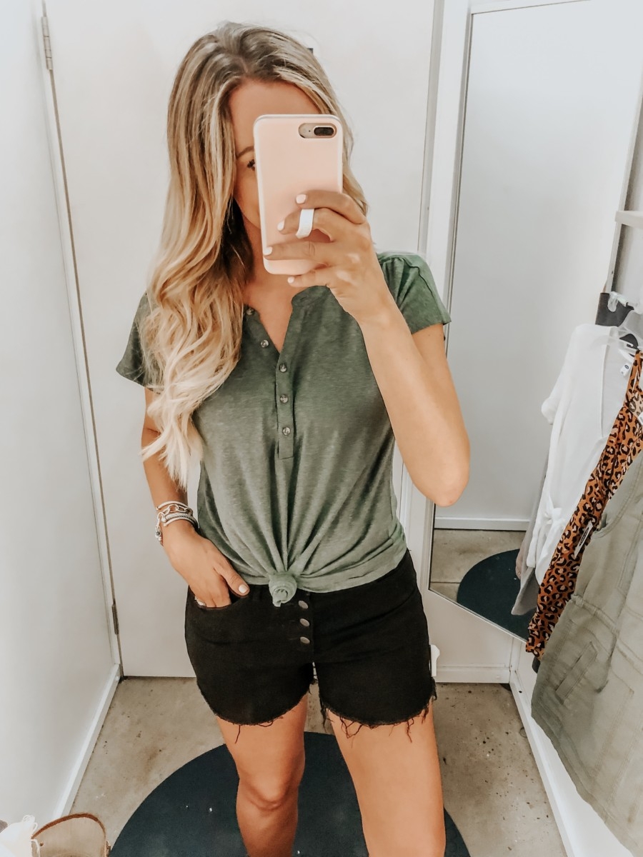 Old Navy Try On - August 2019 by popular Florida fashion blog, Haute and Humid: image of a woman standing in a Old Navy dressing room and wearing an Old Navy Linen-Blend Dolman-Sleeve Henley and Old Navy High-Waisted Button-Fly Jean Cut-Offs. 
