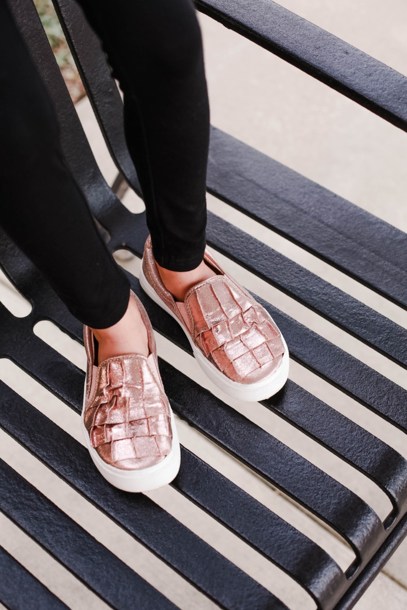girls slip on sneakers | fall girls clothing | Girls Animal Print fall Clothes | Walmart Fall Clothing: Girls Animal Print Favorites by popular Houston fashion blog, Haute and Humid: image of a girl wearing metallic rose gold ruffle sneakers and black leggings.