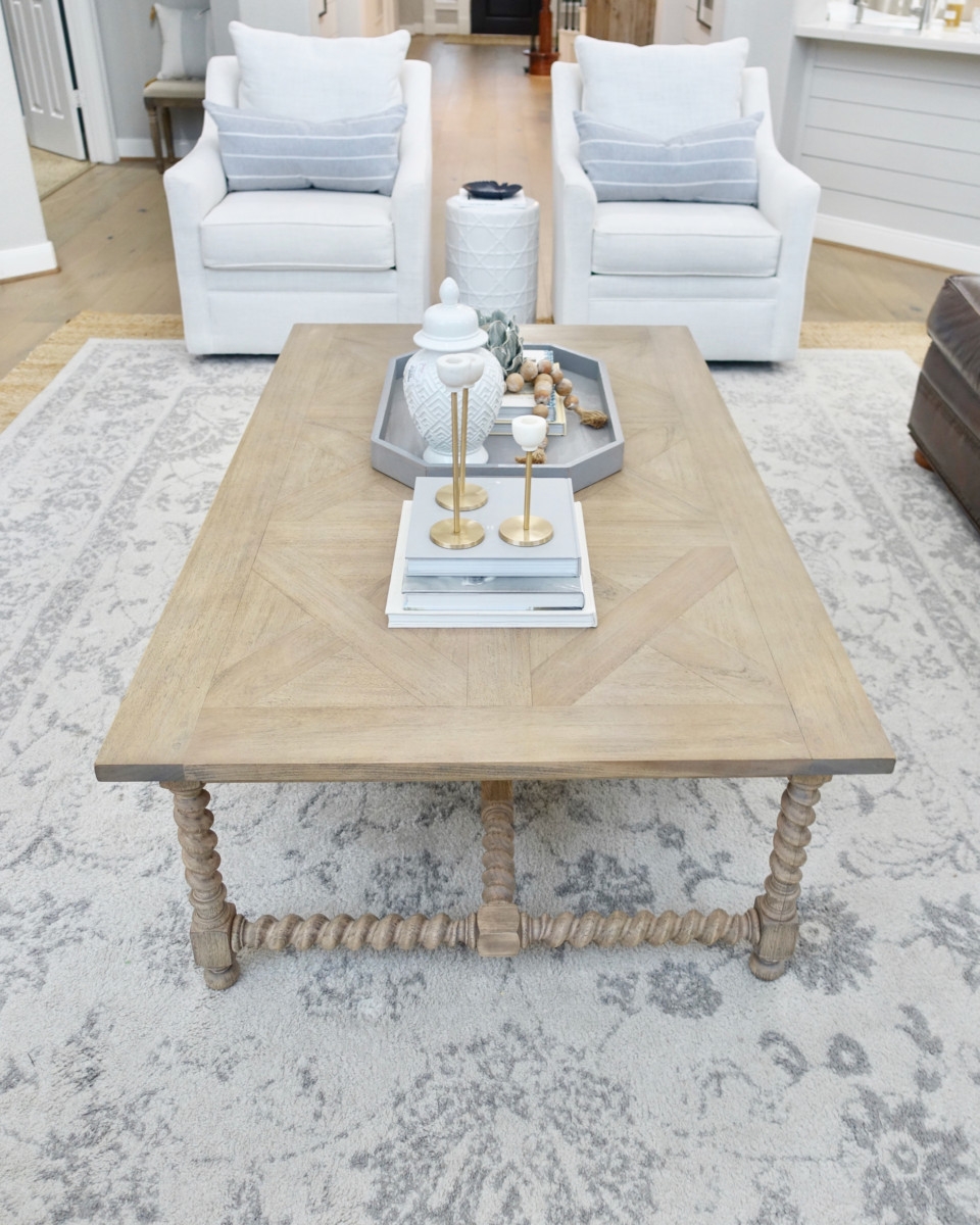 rectangle coffee table | Living Room Makeover by popular Houston lifestyle blog, Haute and Humid: image of a remodeled living room with a Wayfair Shayla 20-Light Candle Style Wagon Wheel Chandelier, Wisteria Barley Twist Coffee Table, and Perigold ARIANA VERNAY RECTANGULAR CONSOLE TABLE.