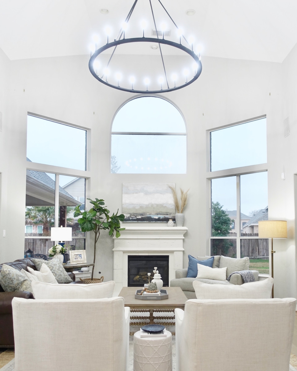 living room remodel | Living Room Makeover by popular Houston lifestyle blog, Haute and Humid: image of a remodeled living room with a Wayfair Shayla 20-Light Candle Style Wagon Wheel Chandelier. 