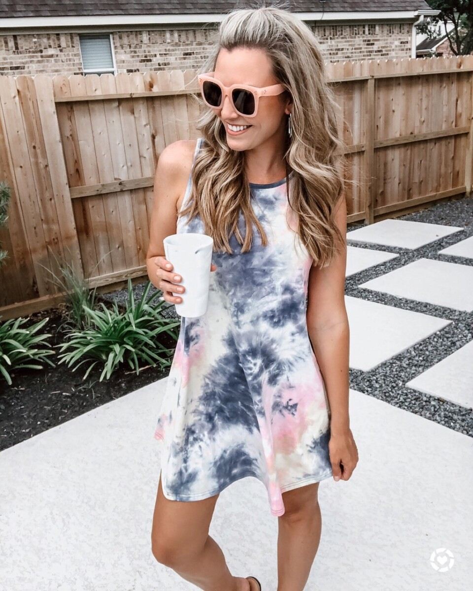 tie dye dress | Amazon Spring Try On by popular Houston fashion blog, Cute and Little: image of a woman wearing a Amazon Romwe Women's Tie Dye Sleeveless Casual Loose T-Shirt Dress Swing Tunic Top, Amazon zeroUV - Retro Oversized Square Sunglasses for Women, and holding a Amazon silicone cup. 