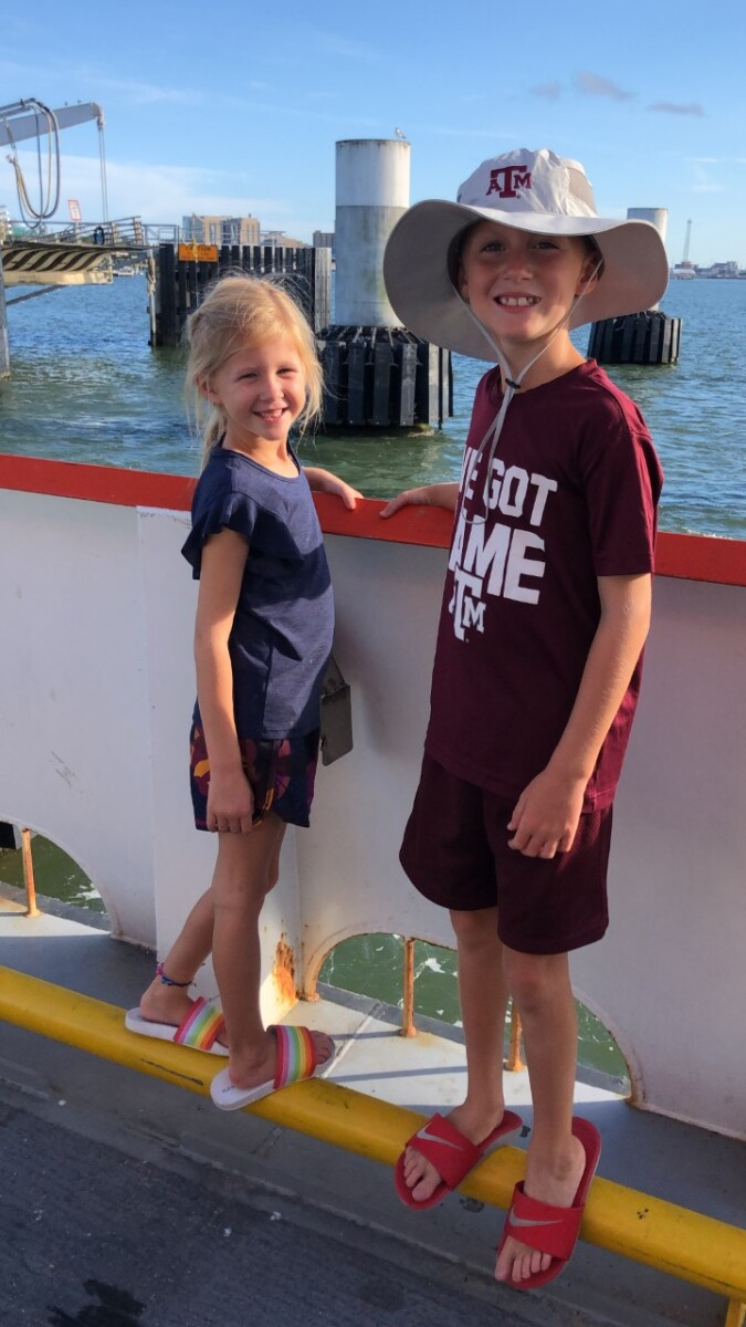 galveston travel guide | Galveston Travel Guide by popular Houston travel blog, Haute and Humid: image of two kids on the Galveston ferry.
