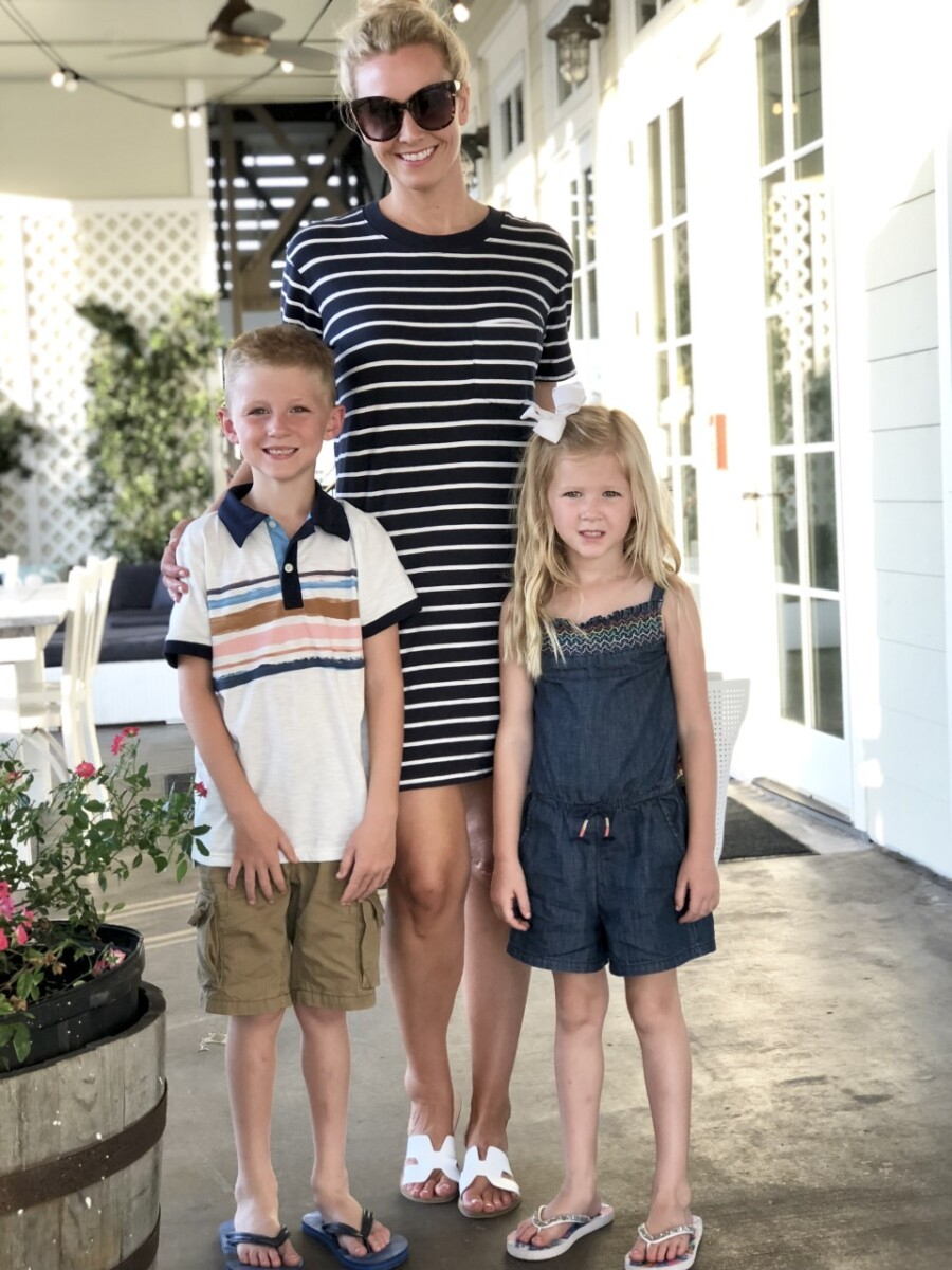 galveston restaurants | Galveston Travel Guide by popular Houston travel blog, Haute and Humid: image of a mom and her two kids standing outside of a restaurant in Galveston, Texas. 