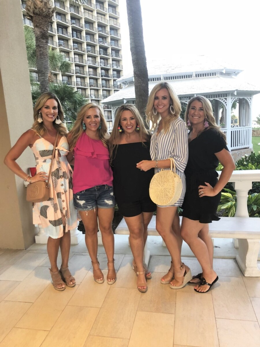 girls weekend in galveston | Galveston Travel Guide by popular Houston travel blog, Haute and Humid: image of group of women standing in the lobby of a Galveston, Texas hotel. 