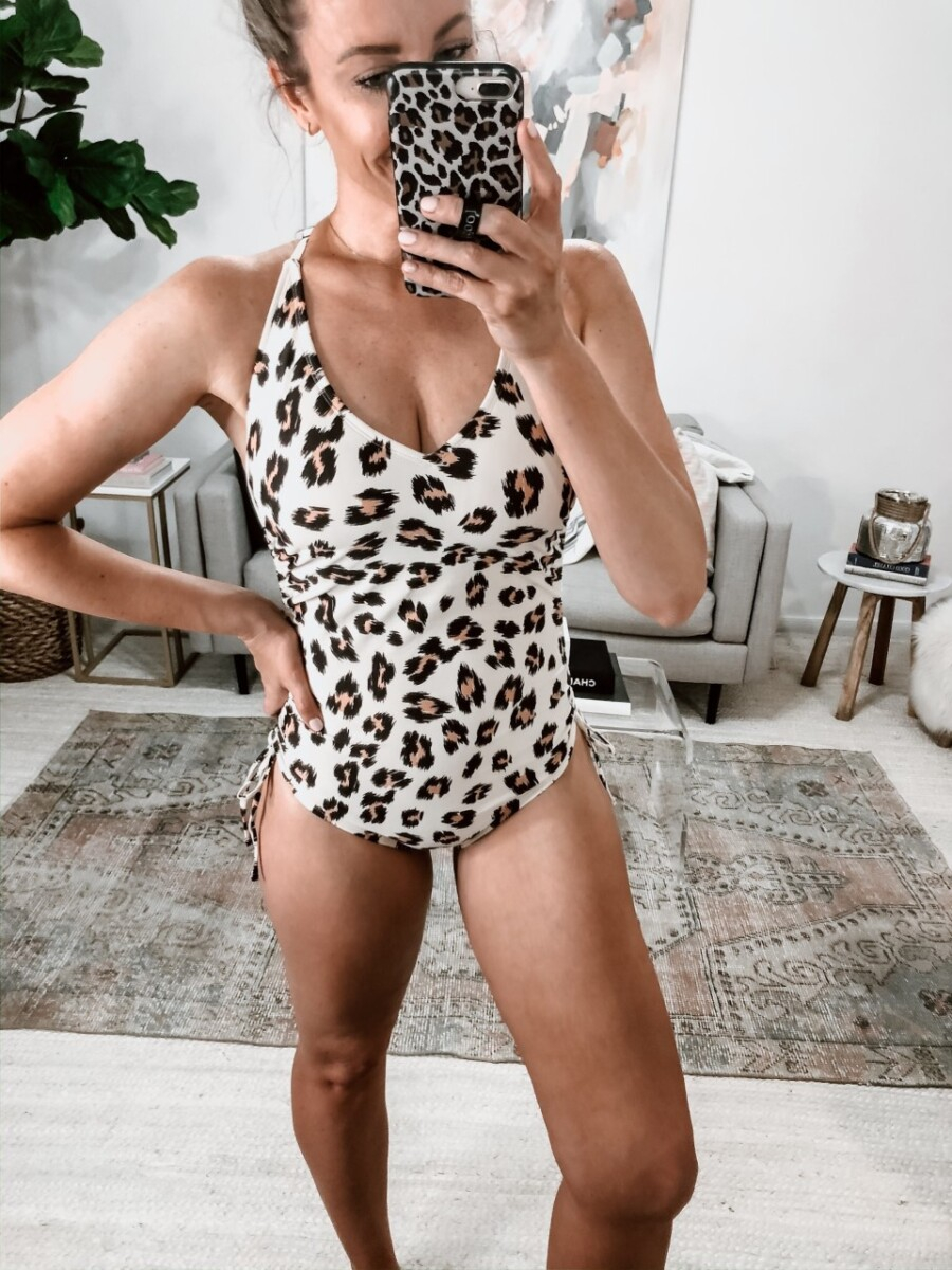 leaopard one piece swimsuit | Galveston Travel Guide by popular Houston travel blog, Haute and Humid: image of a woman wearing a leopard print swimsuit. 