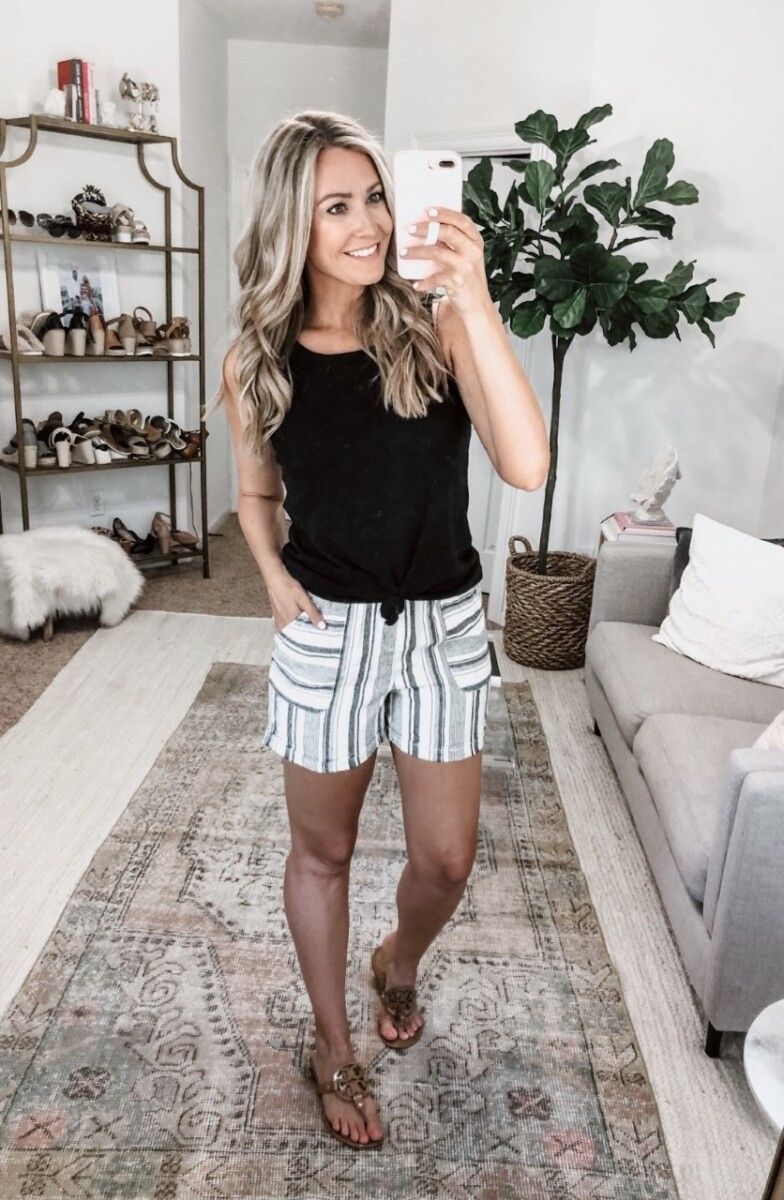 striped shorts | Summer Style by popular Houston fashion blog, Haute and Humid: image of a woman sitting outside and wearing a Walmart Time and Tru Women's Linen Shorts and Walmart Time and Tru Women's Sleeveless Henley Tank Top.