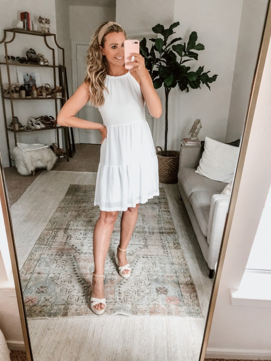 White Summer Dresses | White Summer Dresses by popular Houston fashion blog, Haute and Humid: image of a woman wearing a white halter dress, Nordstrom BP. Gabby Woven Wedge Sandal, and Amazon Funtopia knotted headband. 