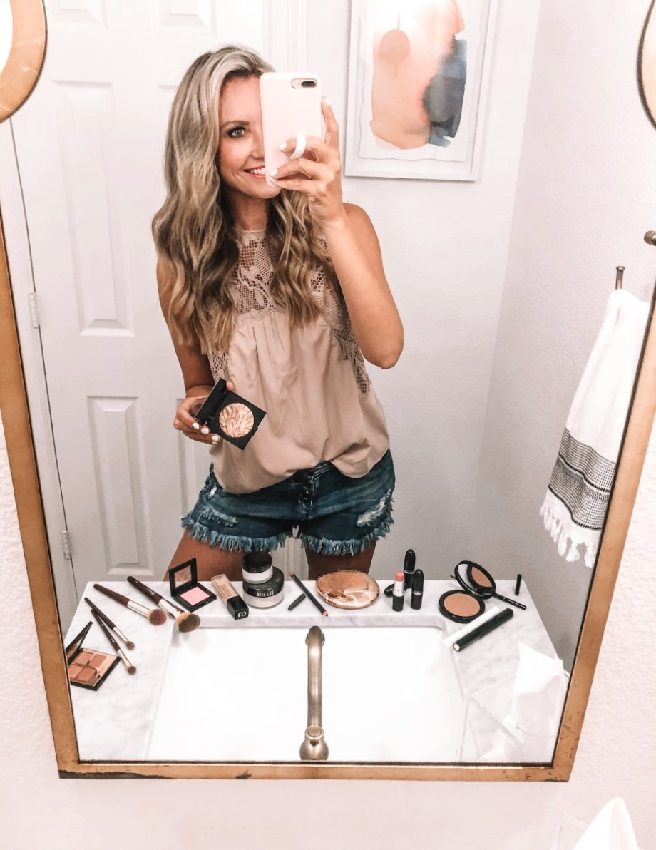 nordstrom makeup | Nordstrom Beauty by popular Houston beauty blog, Haute and Humid: image of a woman standing in her bathroom next to various Nordstrom beauty products. 