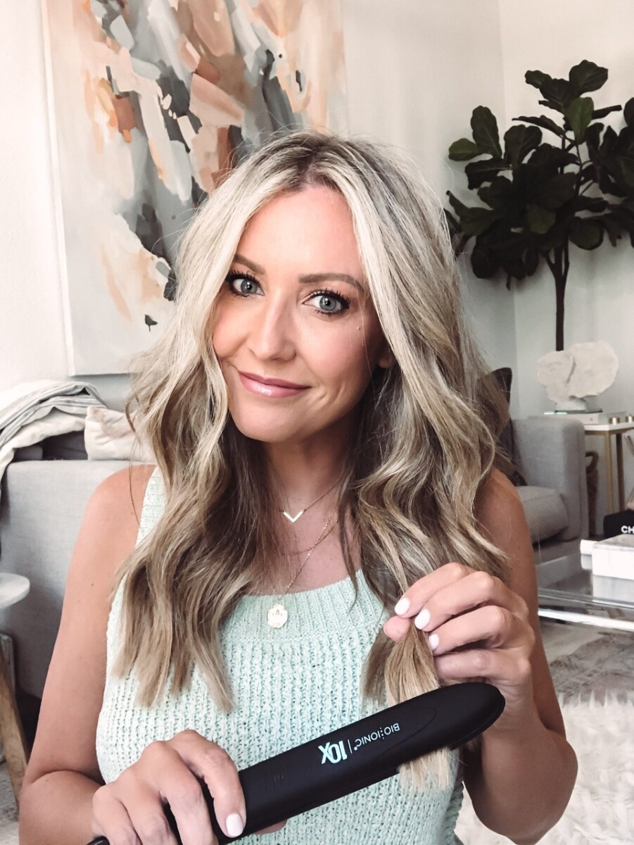 bio ionic flat iron | Nordstrom Anniversary Sale by popular Houston beauty blog, Haute and Humid: image of a woman holding a Bio Ionic flat iron. 