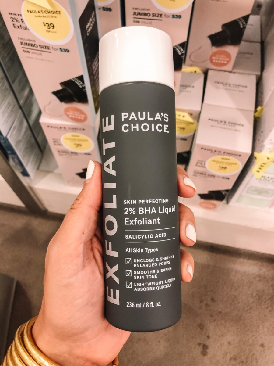 paulas choice | Nordstrom Anniversary Sale by popular Houston beauty blog, Haute and Humid: image of a woman holding Paula's Choice exfoliate. 