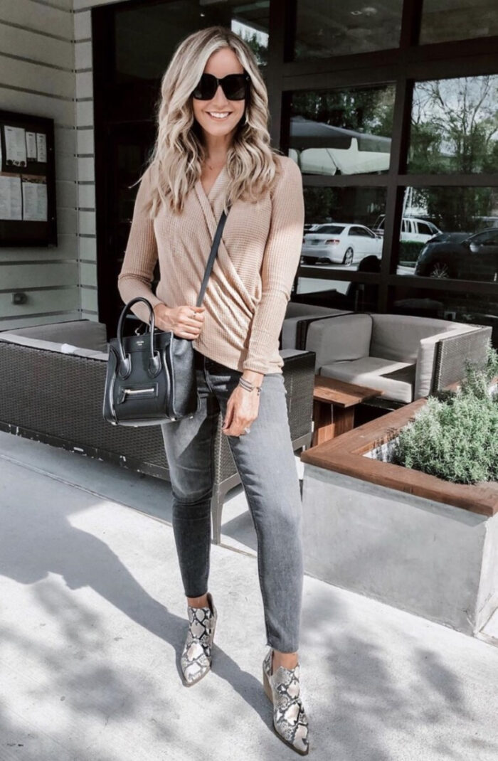 nordstrom anniversary sale 2020 | Nordstrom Anniversary Sale by popular Houston life and style blog, Haute and Humid: image of a woman wearing a long sleeve tan top, black jeans, and snake print boots.