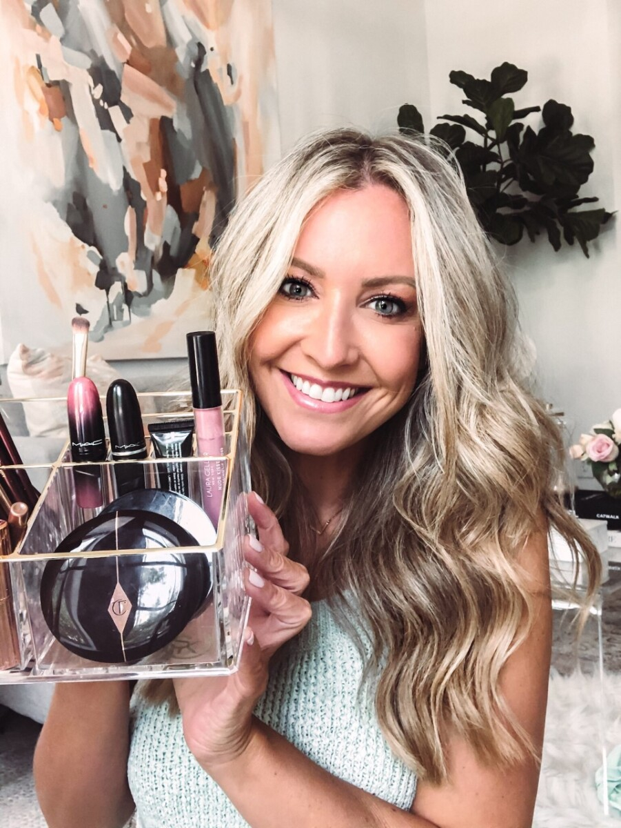 nordstrom anniversary sale |  Nordstrom Anniversary Sale by popular Houston beauty blog, Haute and Humid: image of a woman holding an acrylic makeup organizer filled with MAC lipstick and Charlotte Tilbury makeup. 