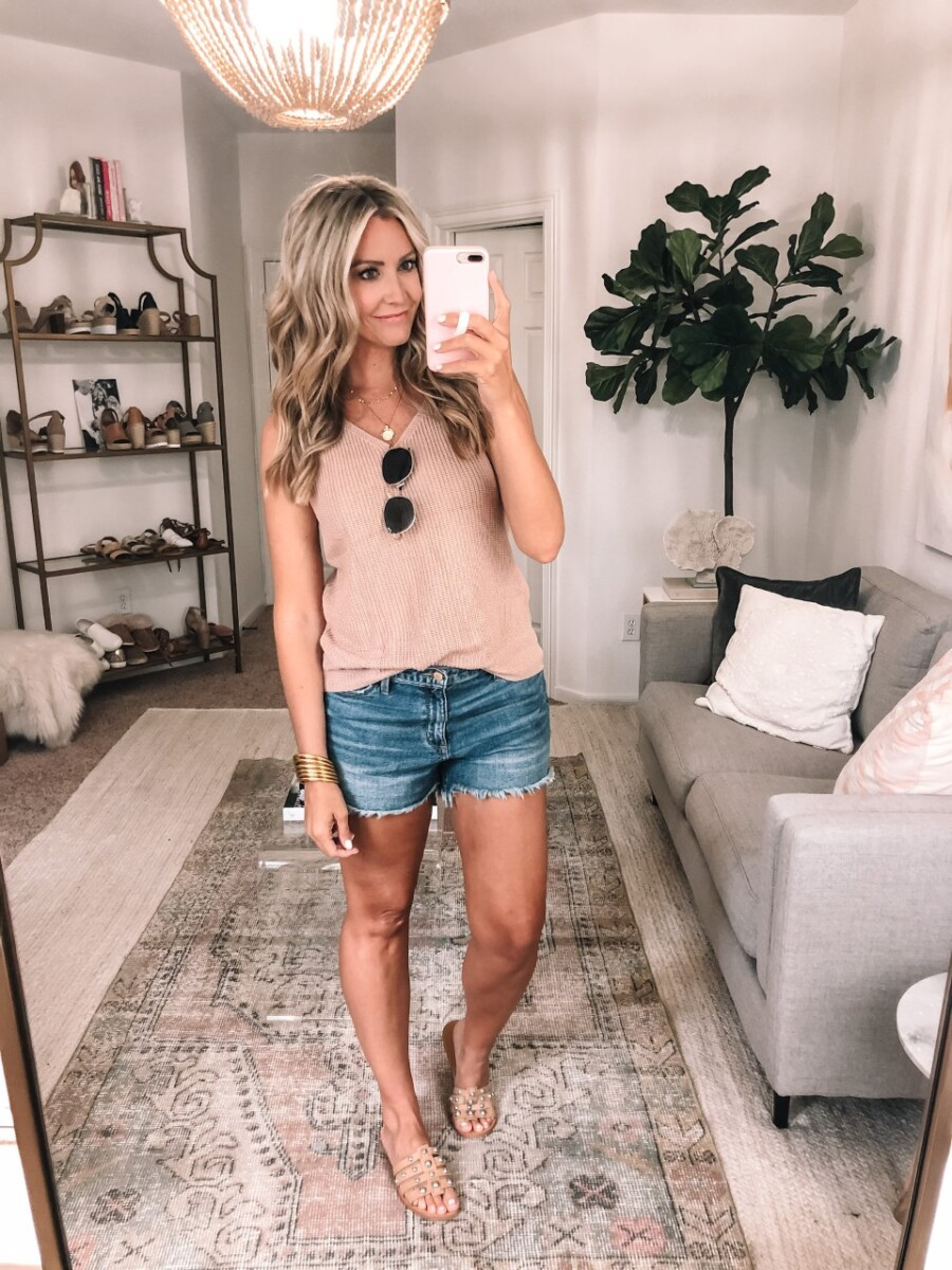 amazon finds under $50 | Best Amazon Products by popular Houston life and style blog: image of a woman wearing a knit tank, denim shorts, and slide sandals. 