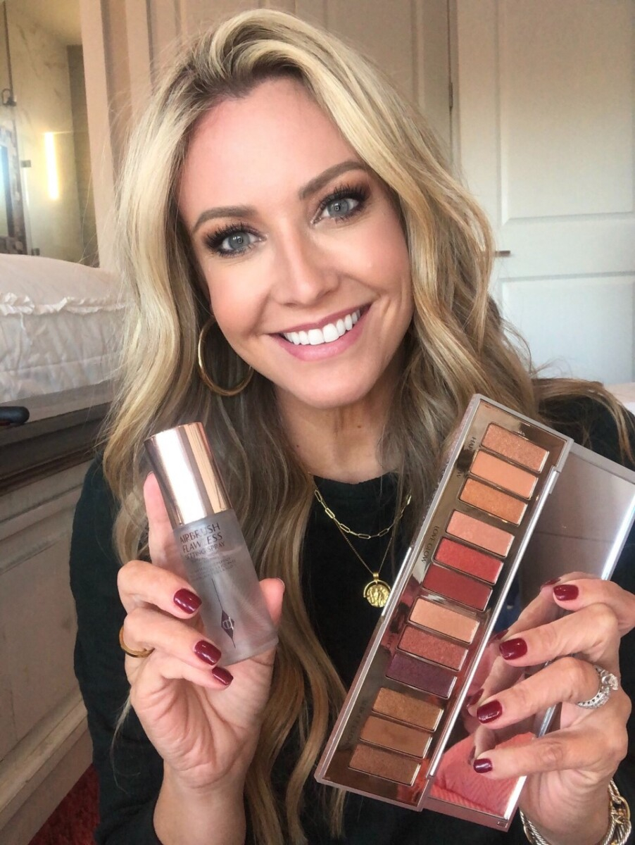 holiday makeup |Nordstrom Beauty by popular Houston beauty blog, Haute and Humid: image of a woman holding some Charlotte Tilbury setting spray and eyeshadow palette. 