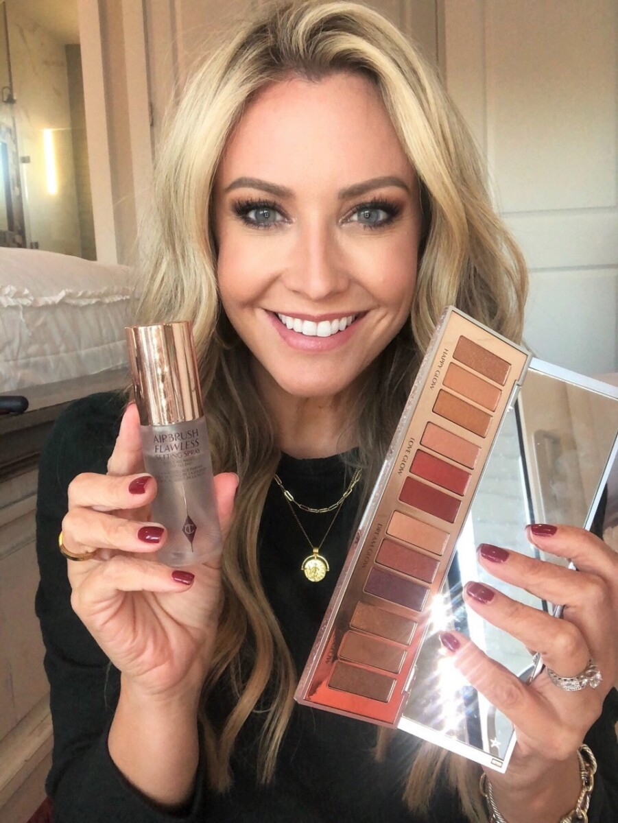 nordstrom makeup |Nordstrom Beauty by popular Houston beauty blog, Haute and Humid: image of a woman holding some Charlotte Tilbury setting spray and eyeshadow palette. 