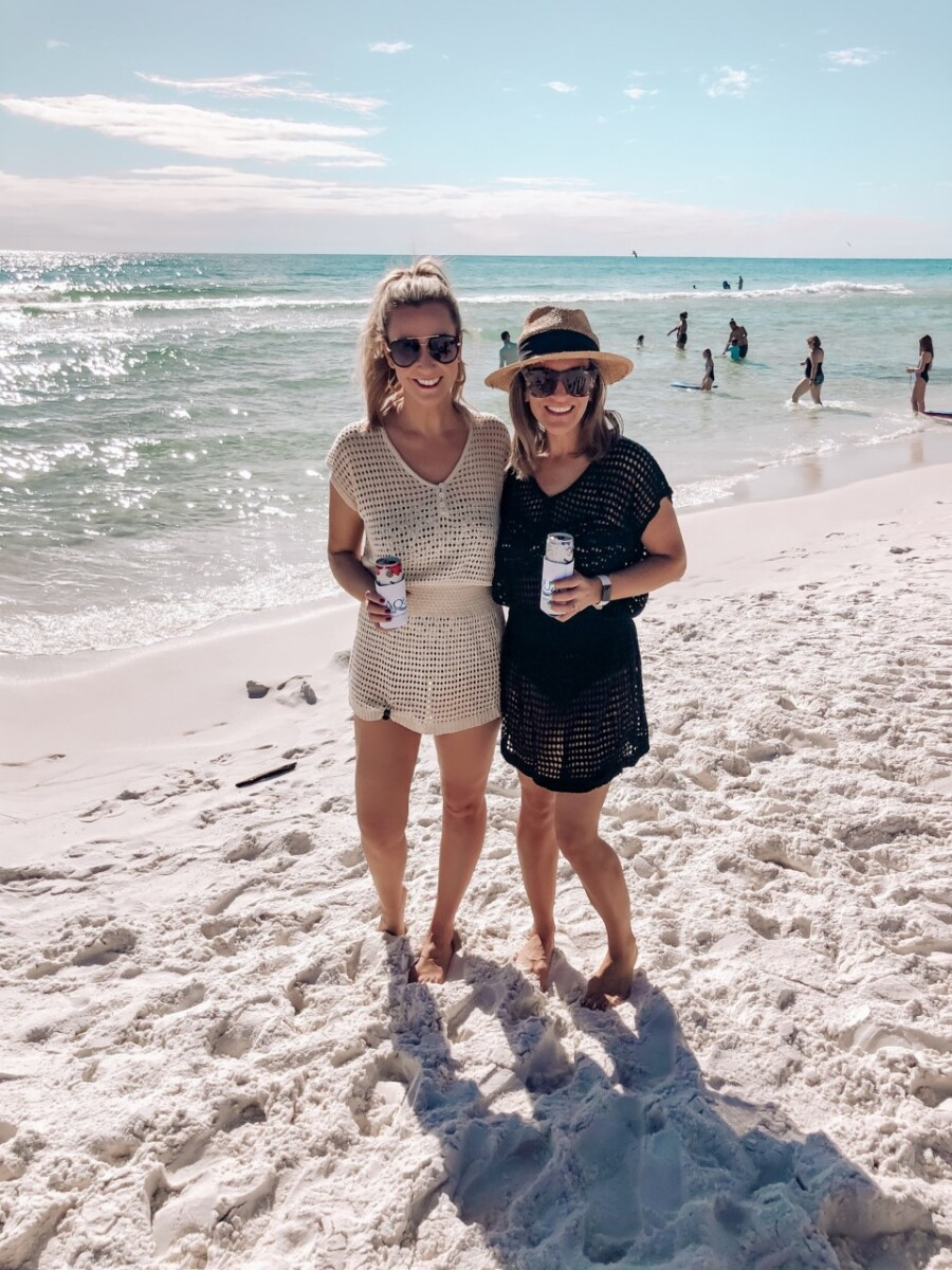 destin beach |Florida Beach House Rental by popular Houston travel blog, Haute and Humid: image of two women standing on a white sand beach in Florida. 