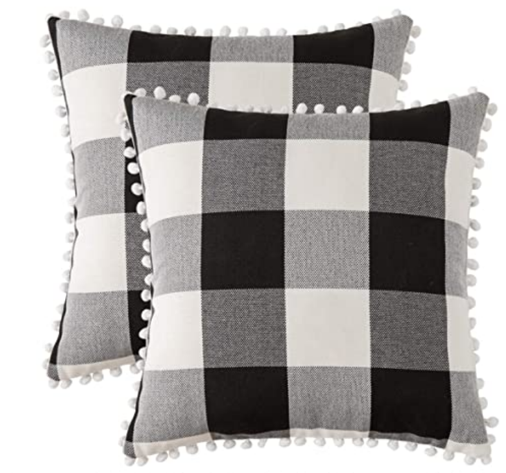 indoor outdoor pillow cover |Amazon Bestsellers by popular Houston life and style blog, Haute and Humid: image of a black and white buffalo plaid pompom pillow. 