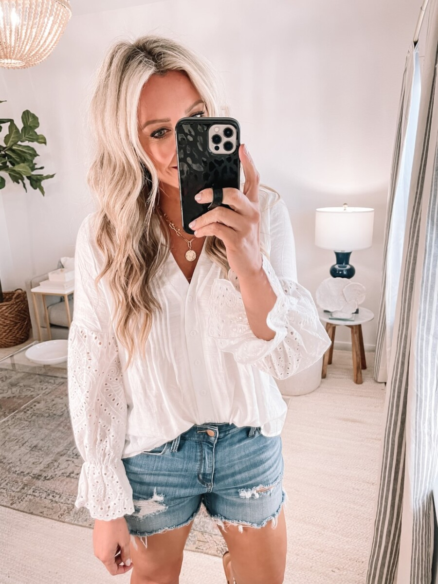 white eyelet top |Amazon Favorites by Houston life and style blog, Haute and Humid: image of a woman wearing a Amazon white eyelet top and a pair of denim cut off shorts. 