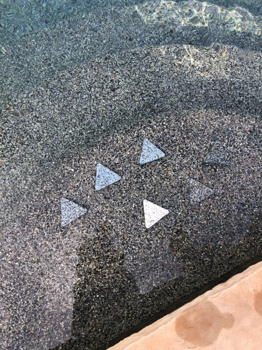 pebble sheen | pool dig | pool before and after | Outdoor Kitchen by popular Houston life and style blog, Haute and Humid: image of triangle pool tiles. 