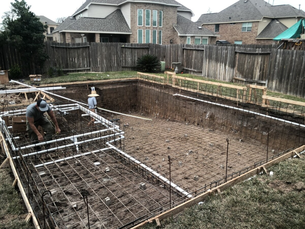 pool design | pool dig | pool before and after | Outdoor Kitchen by popular Houston life and style blog, Haute and Humid: image of people building a pool in the backyard. 