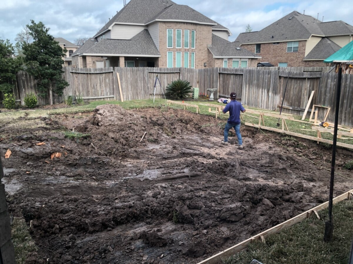 pool build | pool dig | pool before and after | Outdoor Kitchen by popular Houston life and style blog, Haute and Humid: image of people building a pool in a backyard. 