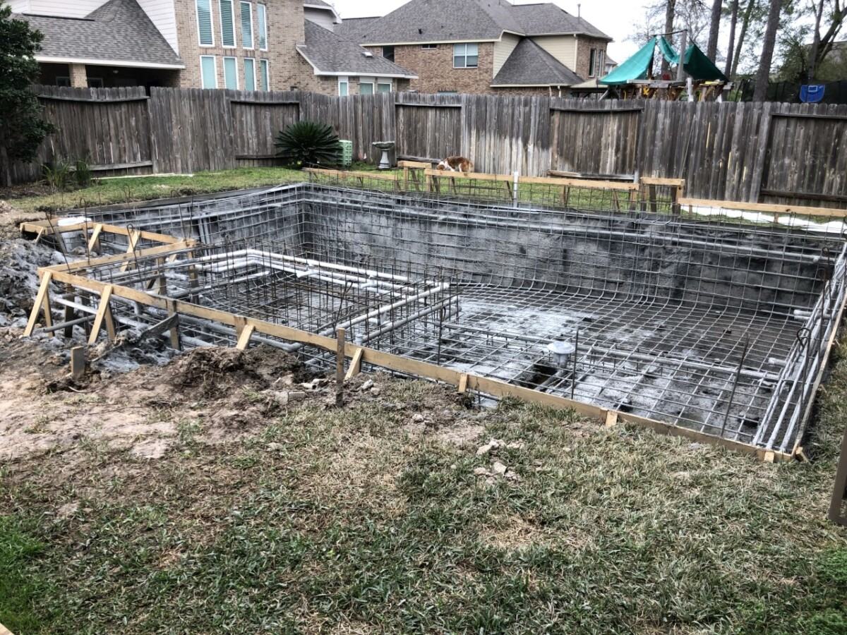 gunnite | pool dig | pool before and after | Outdoor Kitchen by popular Houston life and style blog, Haute and Humid: image of people building a pool. 