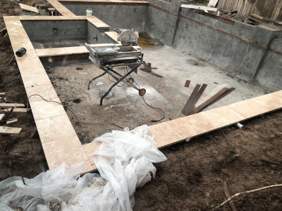 Pool and Outdoor Kitchen Design | pool dig | pool before and after | Outdoor Kitchen by popular Houston life and style blog, Haute and Humid: image of people building a pool in the backyard. 