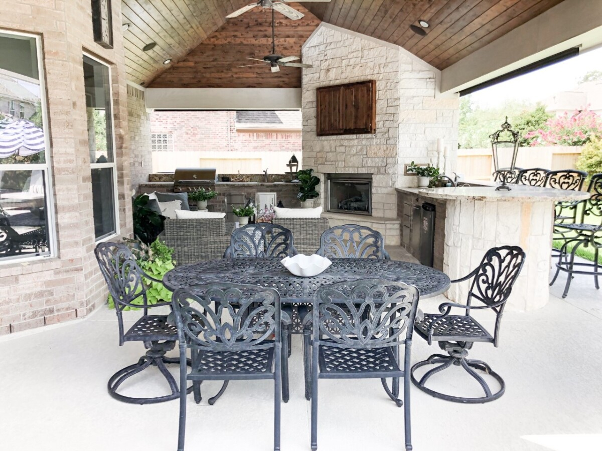outdoor kitchen | Outdoor Kitchen by popular Houston life and style blog, Haute and Humid: image of a black outdoor table and chairs. 