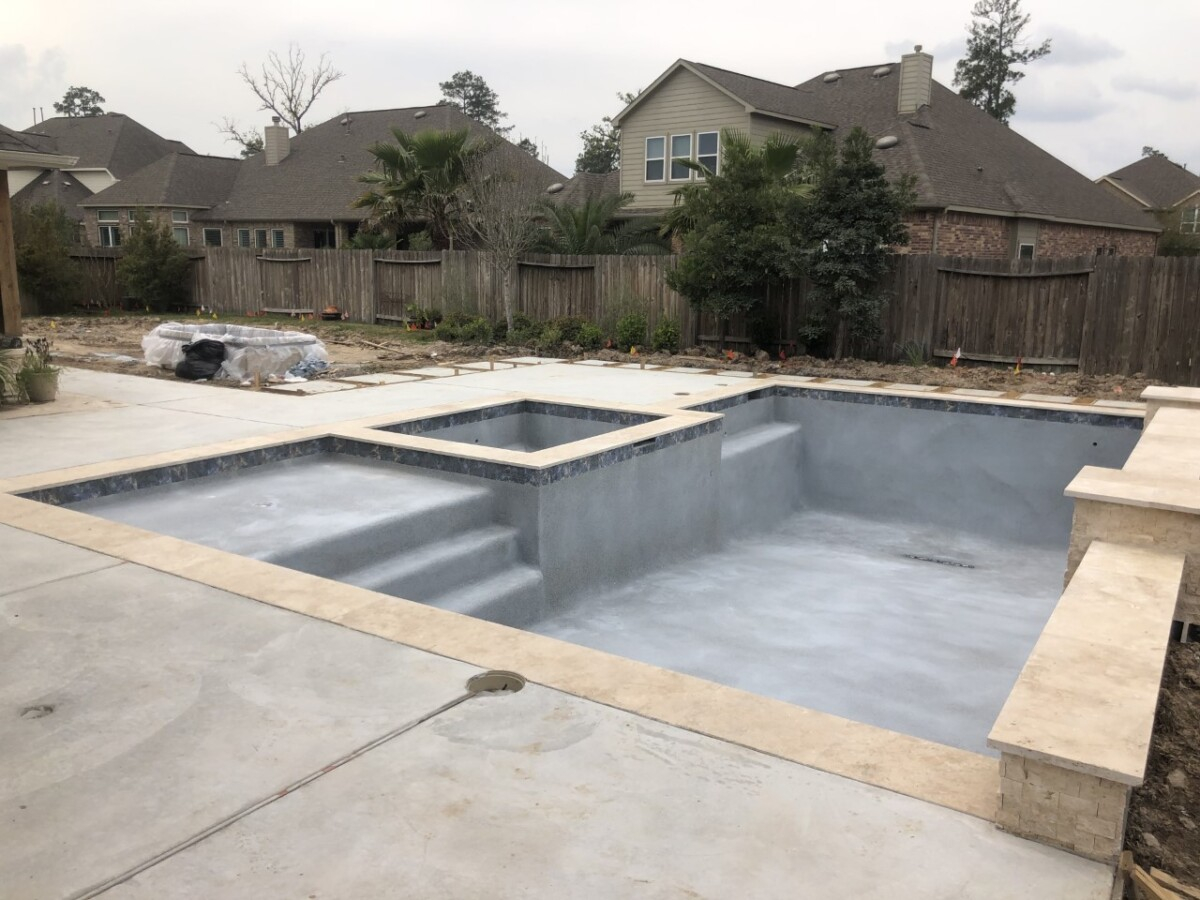 pool decking | pool dig | pool before and after | Outdoor Kitchen by popular Houston life and style blog, Haute and Humid: image of pool decking. 