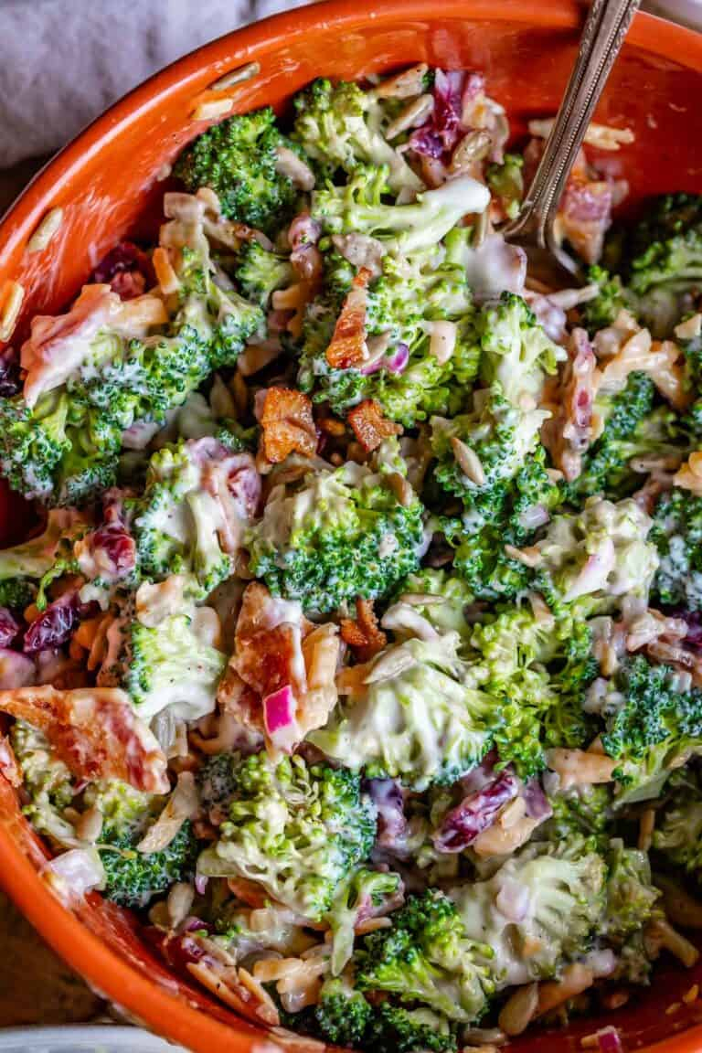 broccoli salad | Summer Side Dishes by popular Houston lifestyle blog, Haute and Humid: broccoli bacon salad in a red bowl.
