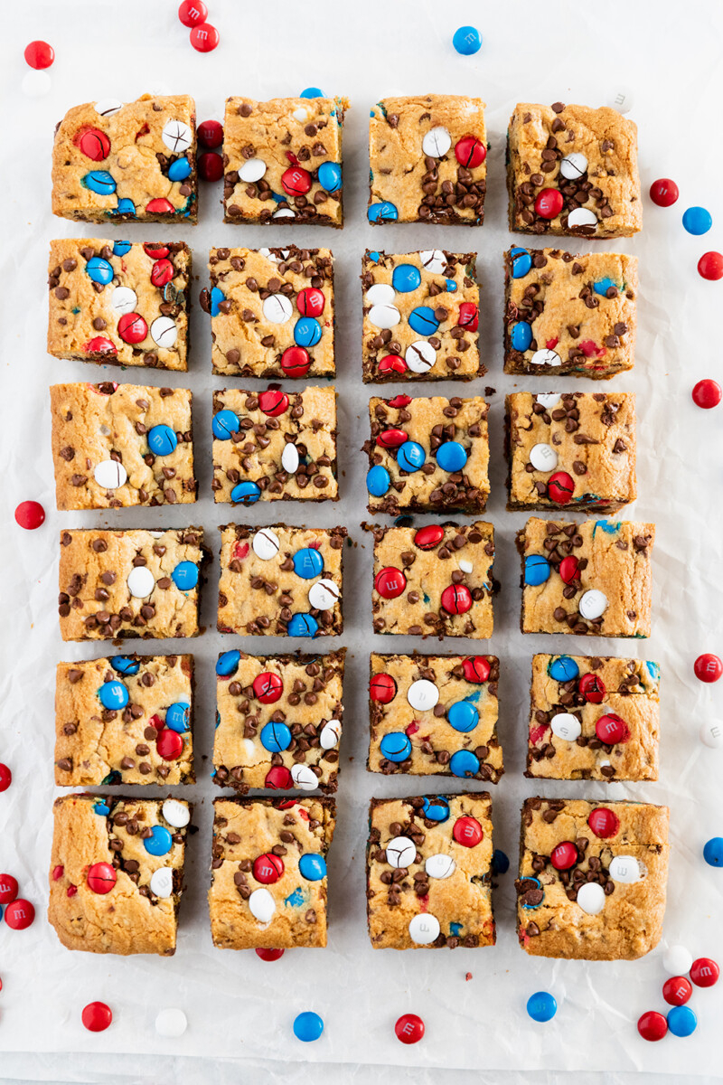m&m cookie bars | 4th of July Desserts by popular Houston lifestyle blog, Haute and Humid: image of red white and blue M&Ms cookie bars.