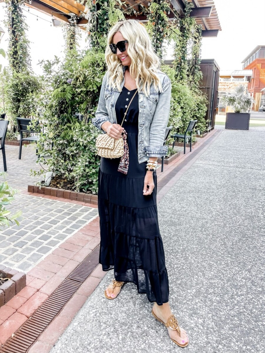 girls trip savannah | Savannah Georgia Travel Guide by popular Houston travel blog, Haute and Humid: image of a woman standing outside and wearing a black maxi dress, light denim jacket, and brown Tory Burch sandals. 