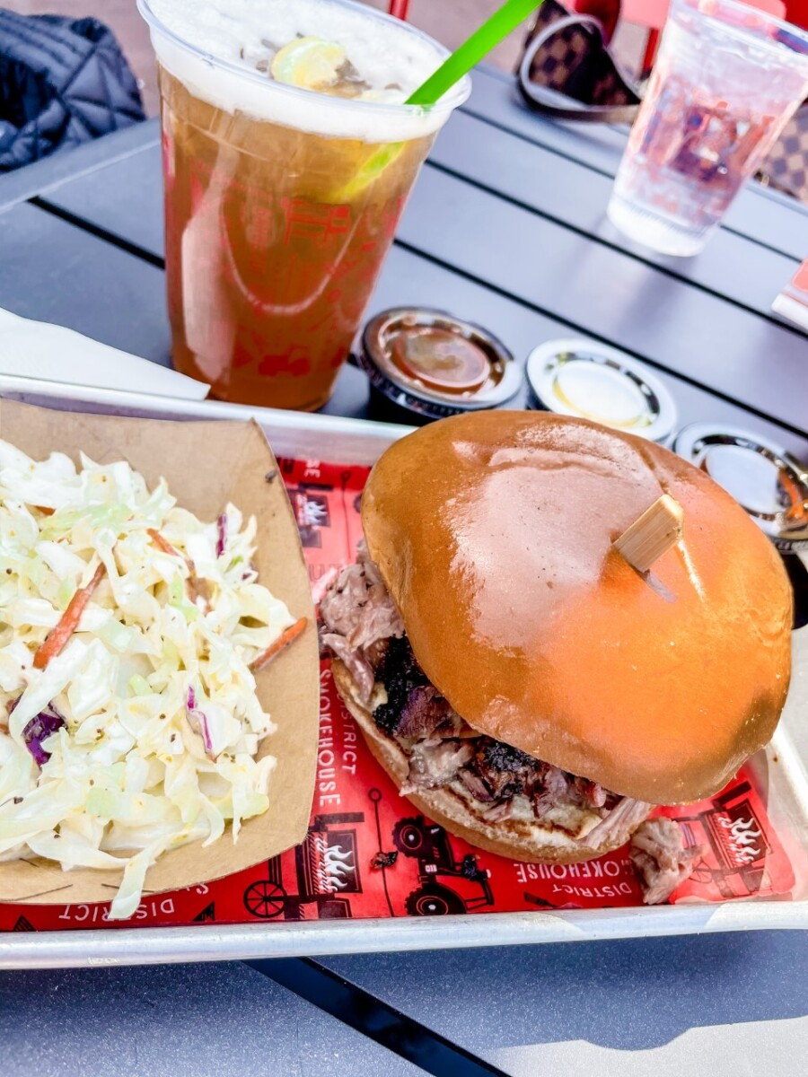 savannah restaurants | Savannah Georgia Travel Guide by popular Houston travel blog, Haute and Humid: image of a pulled pork sandwich and coleslaw. 