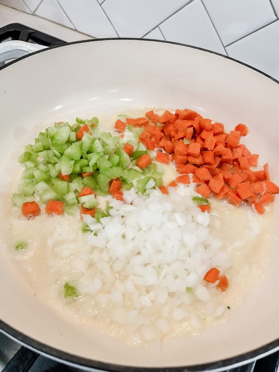 weekly meal planning | Meal Planning Tips by popular Houston lifestyle blog, Haute and Humid: image of chopped celery, carrots, and onions in a pot.