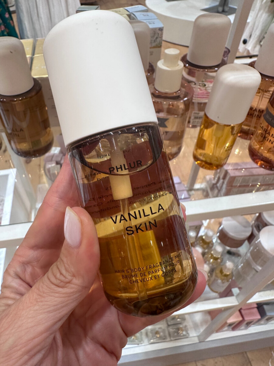 Close up of Phlur Vanilla Skin hair and body fragrance mist displayed in store.